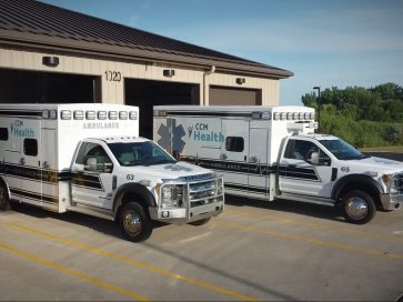 Article image: Fleet of ambulances parked in front of a garage in Montevideo, MN.