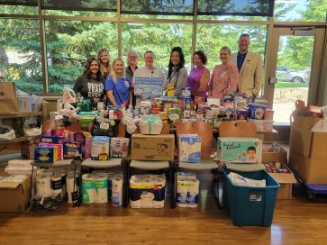 Article image: CCM Health Employees Raise Over 1,500 Items and $1,383 for Local Food Shelf